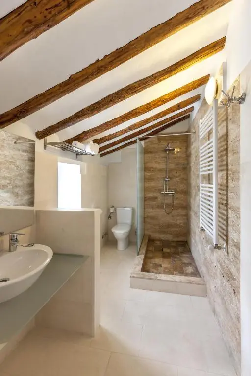 Private bathroom with bath and shower